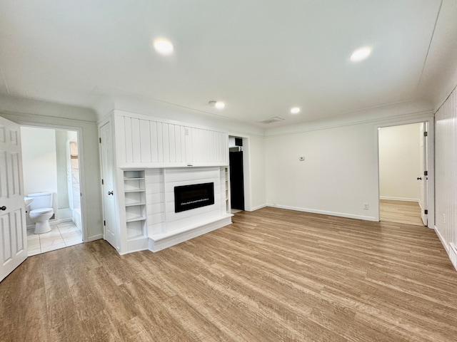 4915 Clarkston Rd, Clarkston, MI 48348 - unfurnished living room featuring light wood-type flooring, a fireplace, recessed lighting, and baseboards