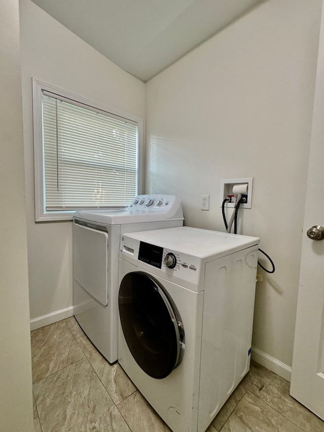 4915 Clarkston Rd, Clarkston, MI 48348 - laundry area featuring washing machine and dryer and baseboards
