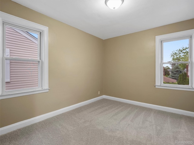 6010 Hartwell St, Dearborn, MI 48126 - carpeted spare room featuring plenty of natural light and baseboards