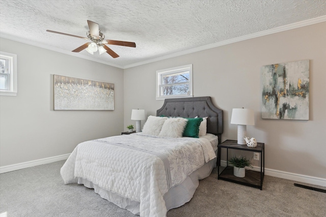 bedroom with carpet, baseboards, a textured ceiling, crown molding, and ceiling fan