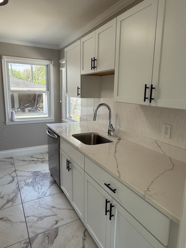 kitchen with a sink, dishwasher, light marble finish floors, backsplash, and ornamental molding