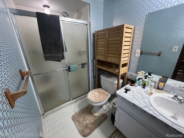 29430 Marimoor Dr, Southfield, MI 48076 - full bathroom with toilet, vanity, a shower stall, and tile patterned floors