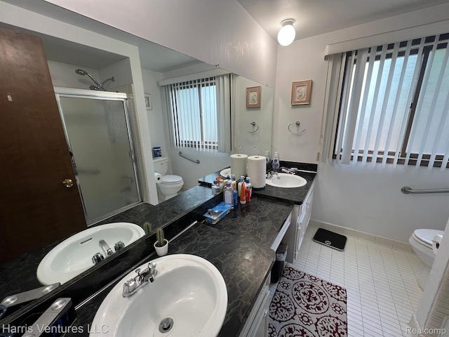 29430 Marimoor Dr, Southfield, MI 48076 - bathroom with toilet, a shower stall, double vanity, and tile patterned floors