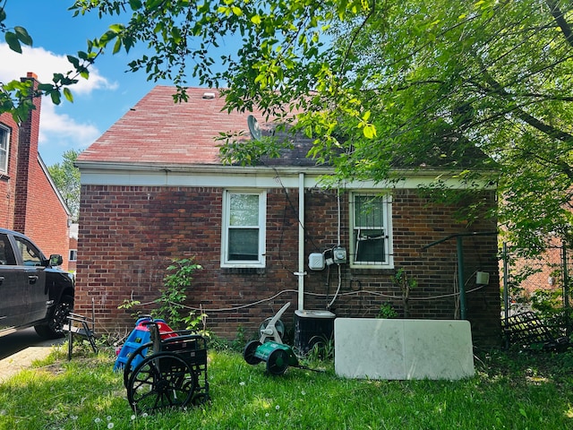 11329 Minock St, Detroit, MI 48228 - view of home's exterior featuring central AC unit and brick siding