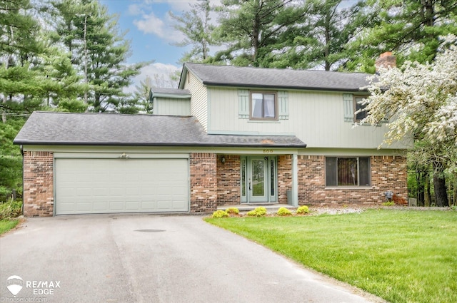 500 Granger Rd, Ortonville, MI 48462 - traditional home with asphalt driveway, brick siding, a chimney, an attached garage, and a front yard