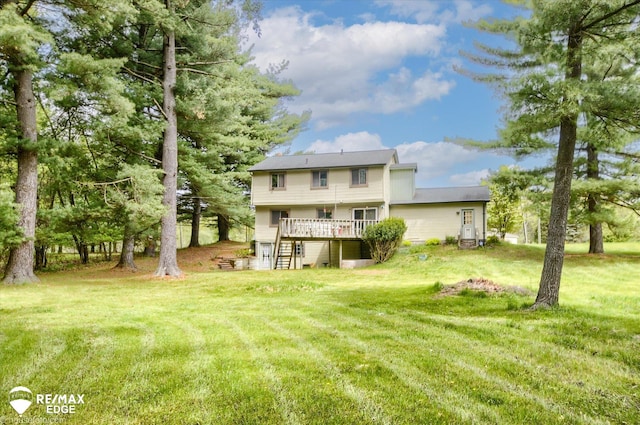 500 Granger Rd, Ortonville, MI 48462 - back of property featuring stairs, a wooden deck, and a yard