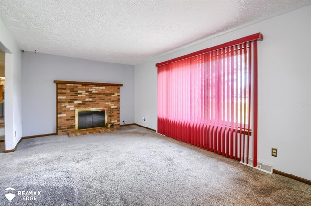 500 Granger Rd, Ortonville, MI 48462 - unfurnished living room featuring carpet, a fireplace, a textured ceiling, and baseboards