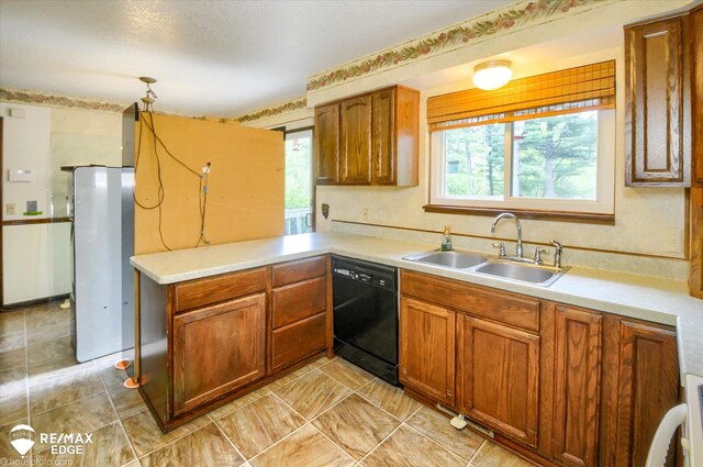 500 Granger Rd, Ortonville, MI 48462 - kitchen featuring black dishwasher, a sink, refrigerator, and light countertops