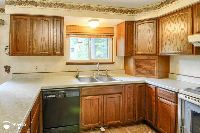 500 Granger Rd, Ortonville, MI 48462 - kitchen featuring black dishwasher, a sink, range with electric cooktop, light countertops, and brown cabinetry