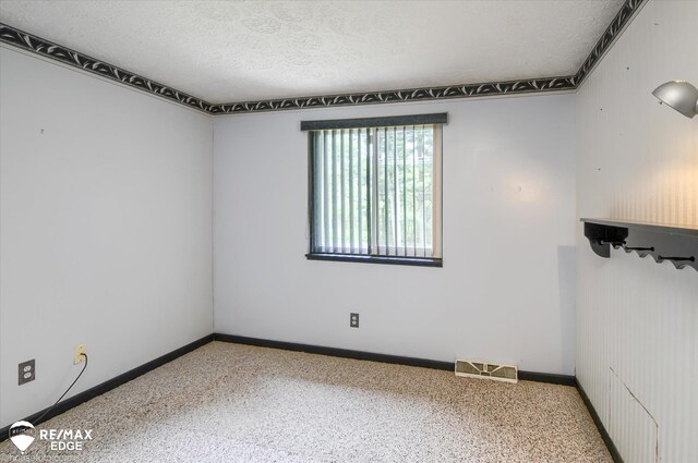 500 Granger Rd, Ortonville, MI 48462 - carpeted spare room with a textured ceiling and baseboards