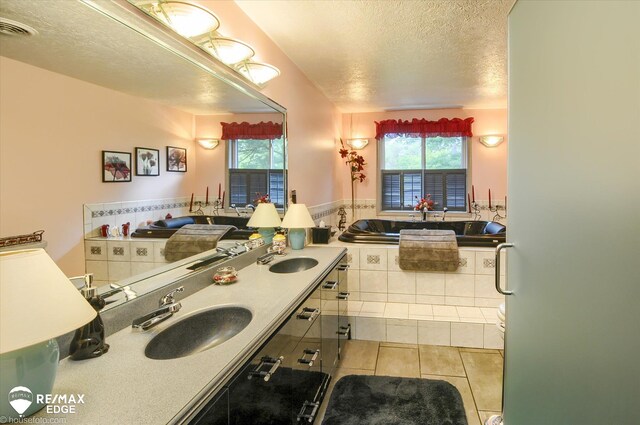 500 Granger Rd, Ortonville, MI 48462 - bathroom featuring a sink, a textured ceiling, tile patterned floors, and healthy amount of natural light