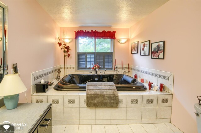 500 Granger Rd, Ortonville, MI 48462 - full bathroom featuring a bath, a textured ceiling, and tile patterned floors