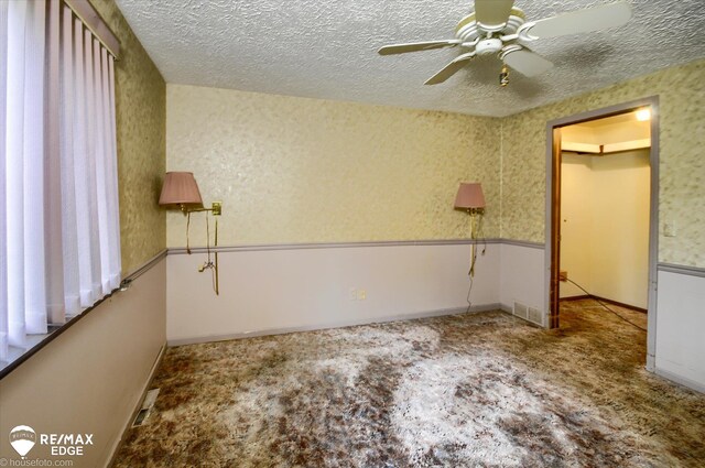 500 Granger Rd, Ortonville, MI 48462 - unfurnished bedroom with a textured ceiling and ceiling fan