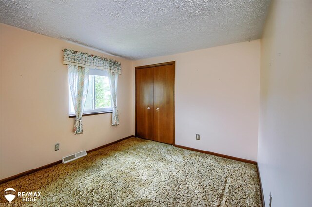 500 Granger Rd, Ortonville, MI 48462 - carpeted spare room with a textured ceiling and baseboards