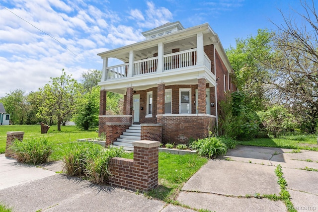 7501 Dunedin St, Detroit, MI 48206 - view of front of home with a balcony, brick siding, a front lawn, a porch, and stairs