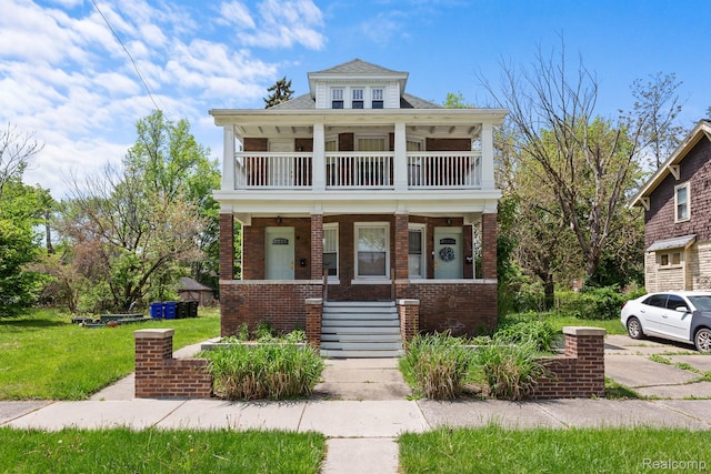 7501 Dunedin St, Detroit, MI 48206 - view of front of house featuring a balcony, brick siding, covered porch, a front lawn, and stairway