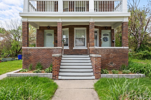 7501 Dunedin St, Detroit, MI 48206 - doorway to property with brick siding, a balcony, and a porch