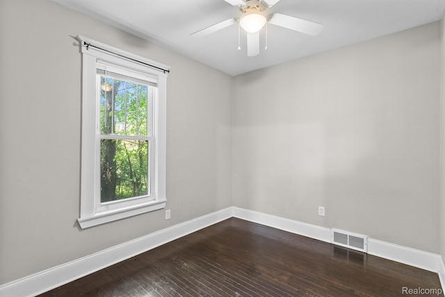 7501 Dunedin St, Detroit, MI 48206 - spare room with dark wood finished floors, baseboards, and ceiling fan