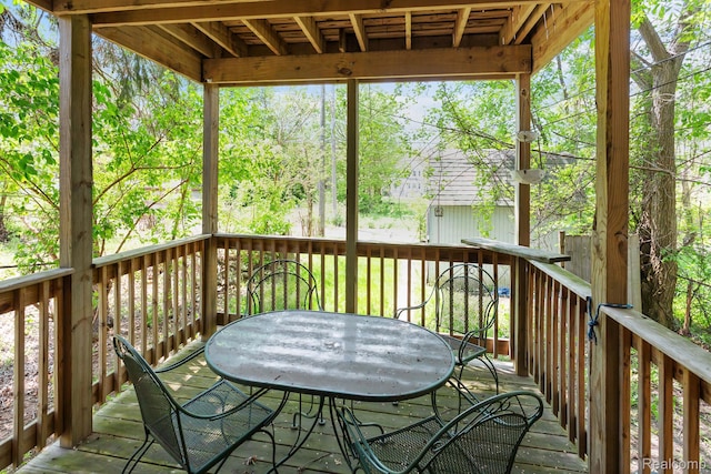 7501 Dunedin St, Detroit, MI 48206 - wooden deck with outdoor dining space