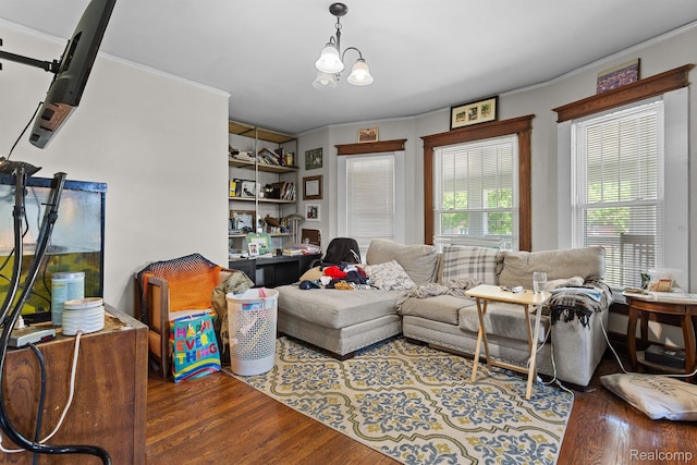 7501 Dunedin St, Detroit, MI 48206 - living room featuring wood finished floors, ornamental molding, and a chandelier