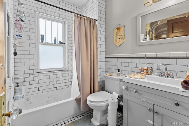 7501 Dunedin St, Detroit, MI 48206 - full bathroom with tile walls, plenty of natural light, toilet, vanity, and shower / bathtub combination with curtain