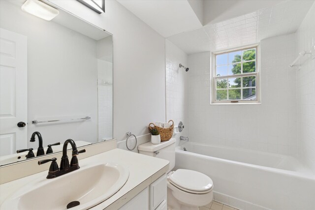 full bath with toilet, washtub / shower combination, vanity, and tile patterned floors