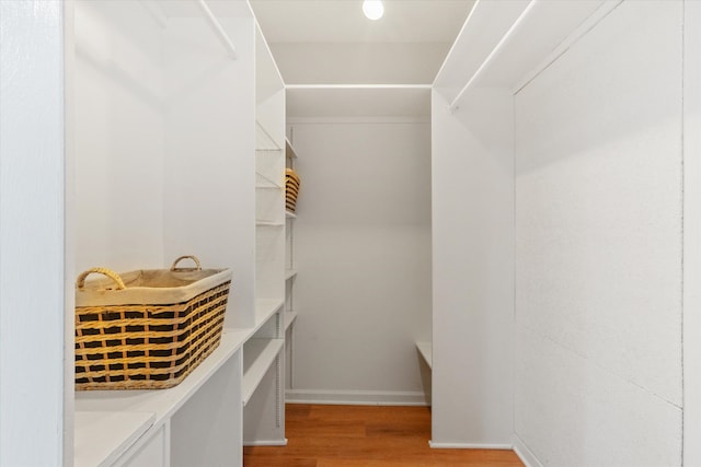 spacious closet with light wood-style floors