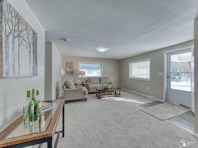 19106 Sylvia Ave, Romulus, MI 48174 - carpeted living room featuring healthy amount of natural light and baseboards