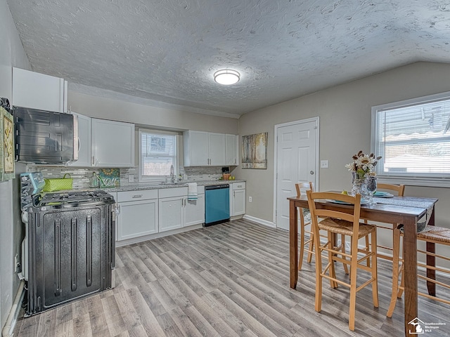 19106 Sylvia Ave, Romulus, MI 48174 - kitchen featuring black microwave, range, dishwasher, white cabinets, and light wood-style flooring