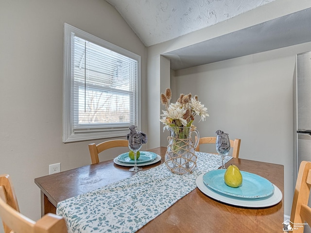 19106 Sylvia Ave, Romulus, MI 48174 - dining area featuring vaulted ceiling