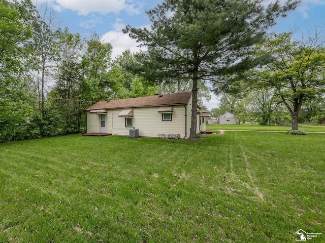 19106 Sylvia Ave, Romulus, MI 48174 - back of property featuring cooling unit and a yard