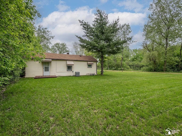 19106 Sylvia Ave, Romulus, MI 48174 - view of grassy yard featuring central AC