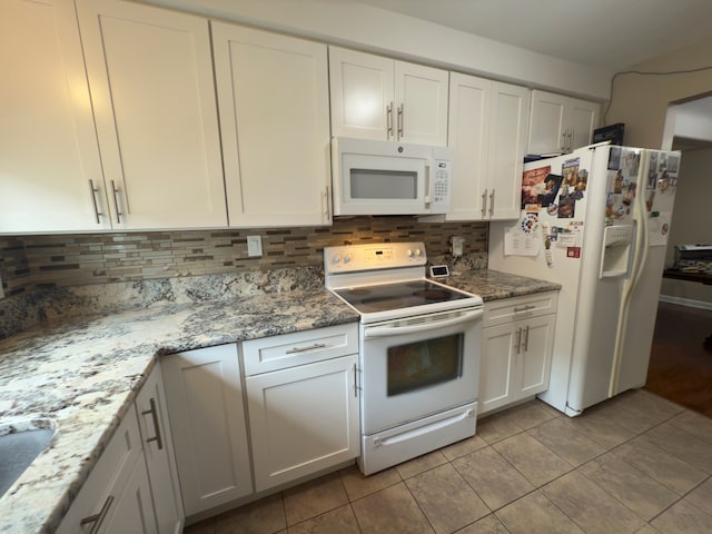 475 N Eton St Unit C7, Birmingham, MI 48009 - kitchen featuring white appliances, tasteful backsplash, and white cabinets