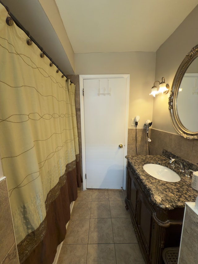 475 N Eton St Unit C7, Birmingham, MI 48009 - bathroom featuring tile patterned flooring, tile walls, and vanity