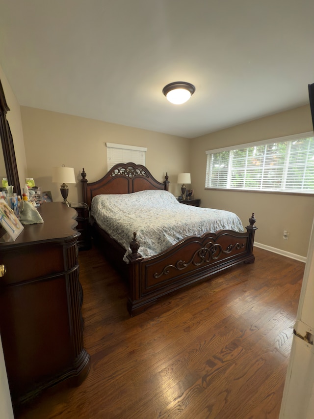 475 N Eton St Unit C7, Birmingham, MI 48009 - bedroom with dark wood-style flooring and baseboards