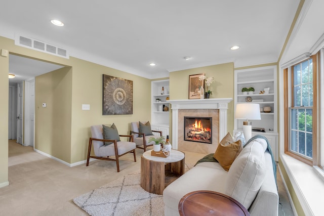 19150 Lexington, Redford, MI 48240 - carpeted living room with baseboards, a tiled fireplace, built in features, and recessed lighting
