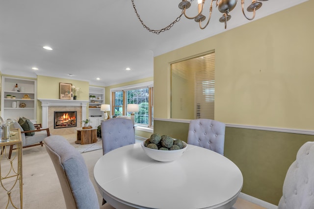 19150 Lexington, Redford, MI 48240 - dining area with a chandelier, a fireplace, built in features, recessed lighting, and baseboards