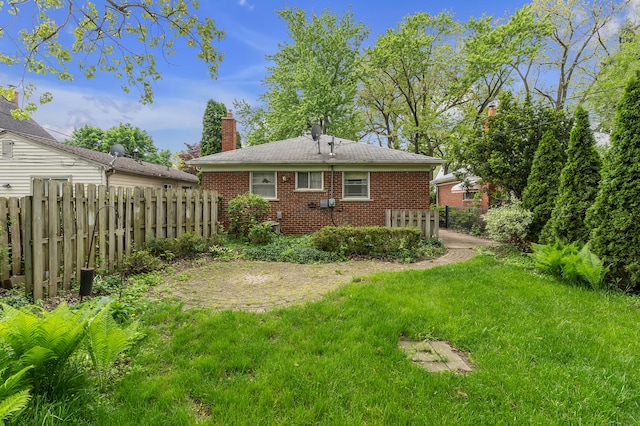 19150 Lexington, Redford, MI 48240 - rear view of house featuring brick siding and a chimney
