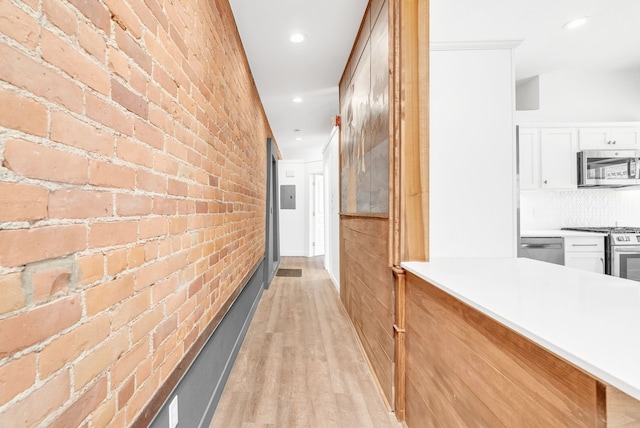 436 E Milwaukee St Unit 8, Detroit, MI 48202 - hall featuring brick wall, light wood-style floors, and recessed lighting