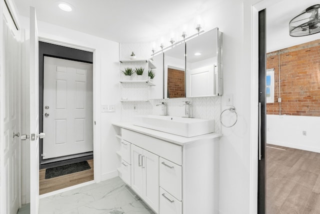 436 E Milwaukee St Unit 8, Detroit, MI 48202 - bathroom with vanity, recessed lighting, tasteful backsplash, and baseboards