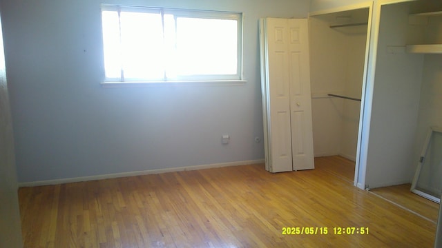 8240 Hampton Rd, Grosse Ile, MI 48138 - unfurnished bedroom featuring light wood-style flooring and baseboards