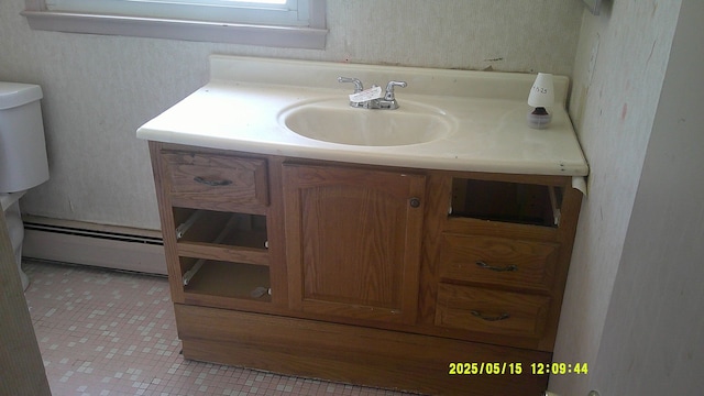 8240 Hampton Rd, Grosse Ile, MI 48138 - bathroom featuring vanity, toilet, and tile patterned floors