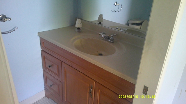 8240 Hampton Rd, Grosse Ile, MI 48138 - bathroom featuring vanity and tile patterned flooring