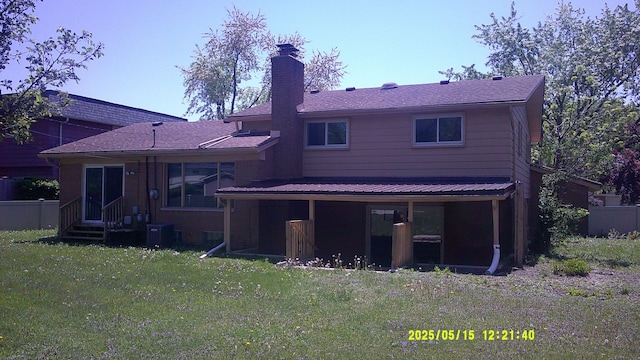 8240 Hampton Rd, Grosse Ile, MI 48138 - back of property with a chimney and central AC