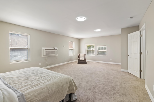 532 Chestnut St, Wyandotte, MI 48192 - bedroom featuring a wall mounted AC, light colored carpet, and baseboards