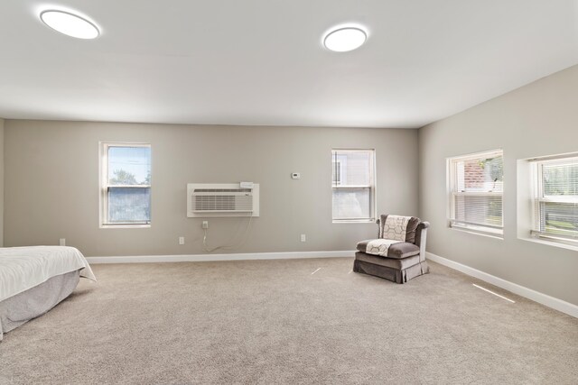 532 Chestnut St, Wyandotte, MI 48192 - bedroom with a wall mounted air conditioner, light colored carpet, and baseboards