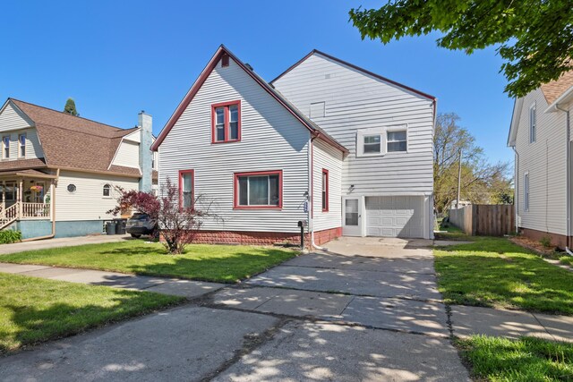 532 Chestnut St, Wyandotte, MI 48192 - view of front facade with an attached garage and concrete driveway