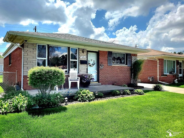 14815 Morris Ave, Allen Park, MI 48101 - view of front facade with brick siding and covered porch
