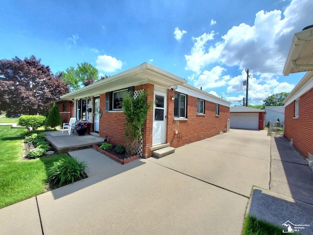 14815 Morris Ave, Allen Park, MI 48101 - view of property exterior with brick siding, an outbuilding, and a detached garage