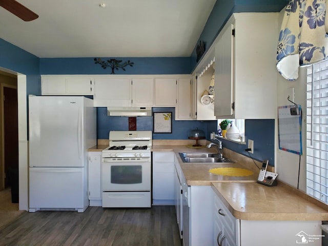 14815 Morris Ave, Allen Park, MI 48101 - kitchen featuring white appliances, under cabinet range hood, light countertops, a sink, and dark wood finished floors